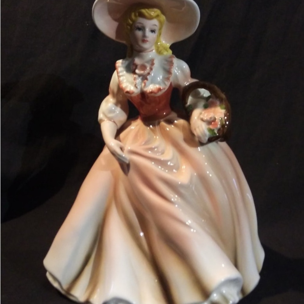 Elegant Porcelain Figurine with Basket